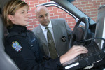 QE0027_Police-Det_Officerincarontilt.jpg