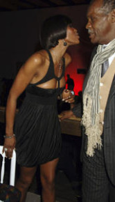 naomi-campbell-cleavage-black-holey-dress-04.jpg