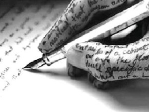 ecrivant, main et papier écrits