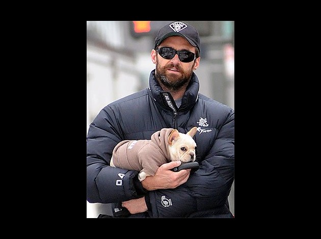 Hugh Jackman carrying his baby